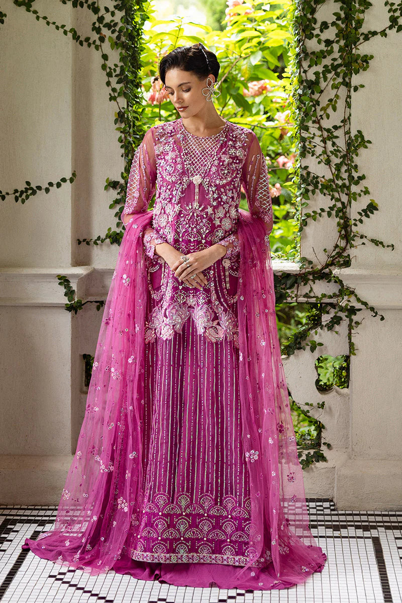 Model wearing deep pink embellished dress from Mushq Sweet November, Pakistani luxury pret for festive events, shop online in UK
