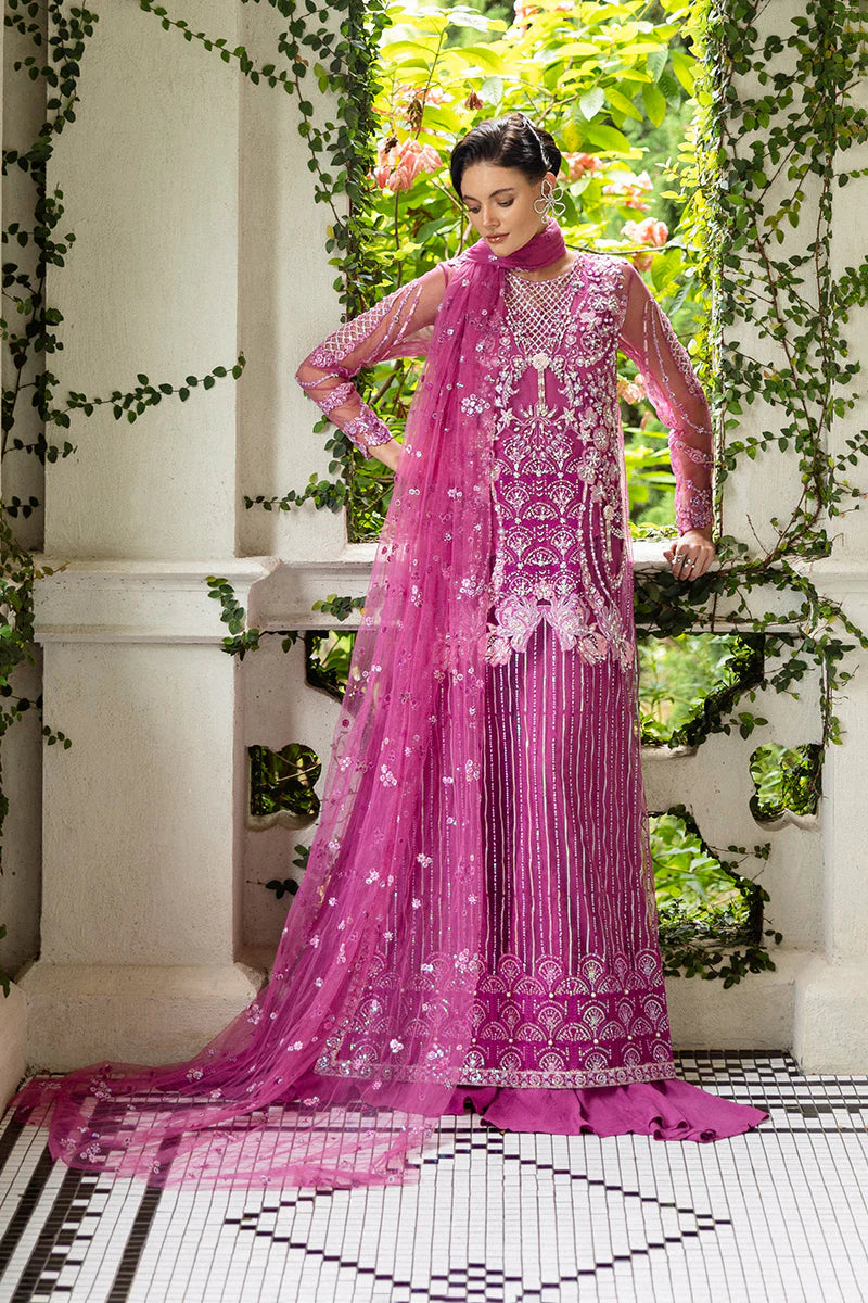 Model wearing deep pink embellished dress from Mushq Sweet November, Pakistani luxury pret for festive events, shop online in UK

