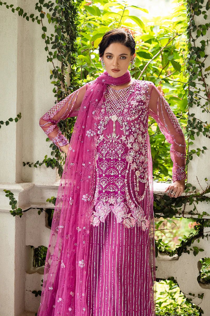 Model wearing deep pink embellished dress from Mushq Sweet November, Pakistani luxury pret for festive events, shop online in UK
