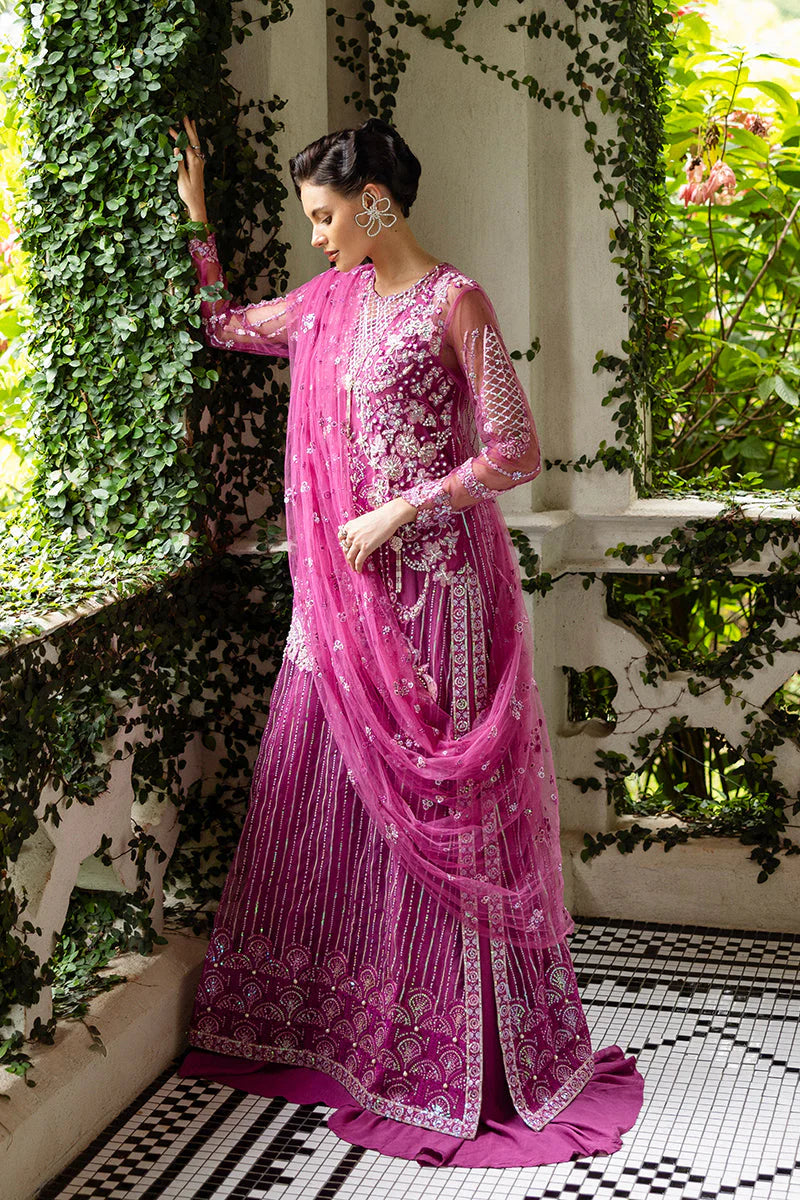 Model wearing deep pink embellished dress from Mushq Sweet November, Pakistani luxury pret for festive events, shop online in UK
