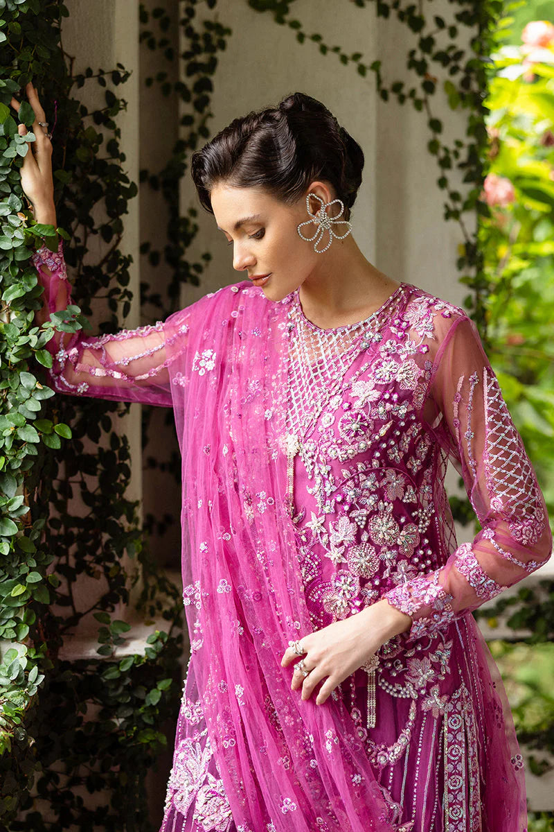 Model wearing deep pink embellished dress from Mushq Sweet November, Pakistani luxury pret for festive events, shop online in UK
