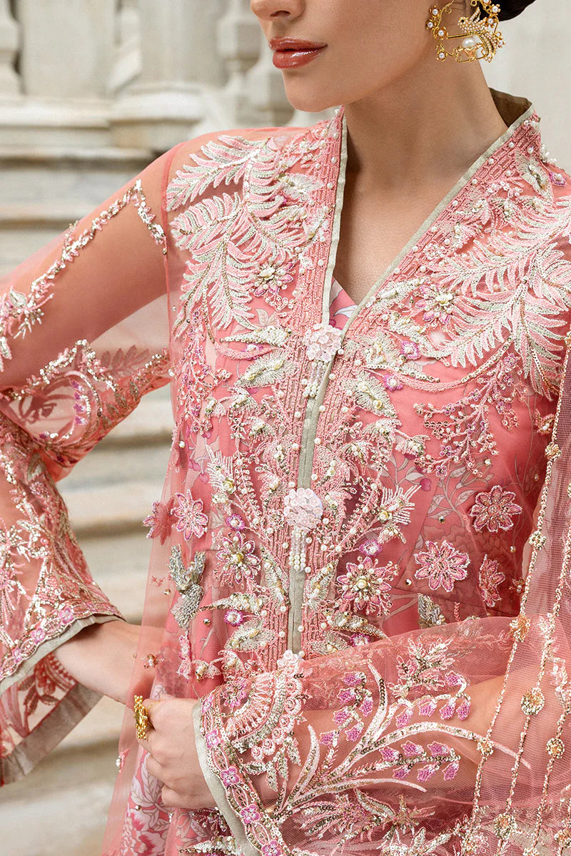 Model wearing peach embroidered dress from Mushq Wings of Desire, Pakistani luxury pret, shop authentic Pakistani clothes online in UK

