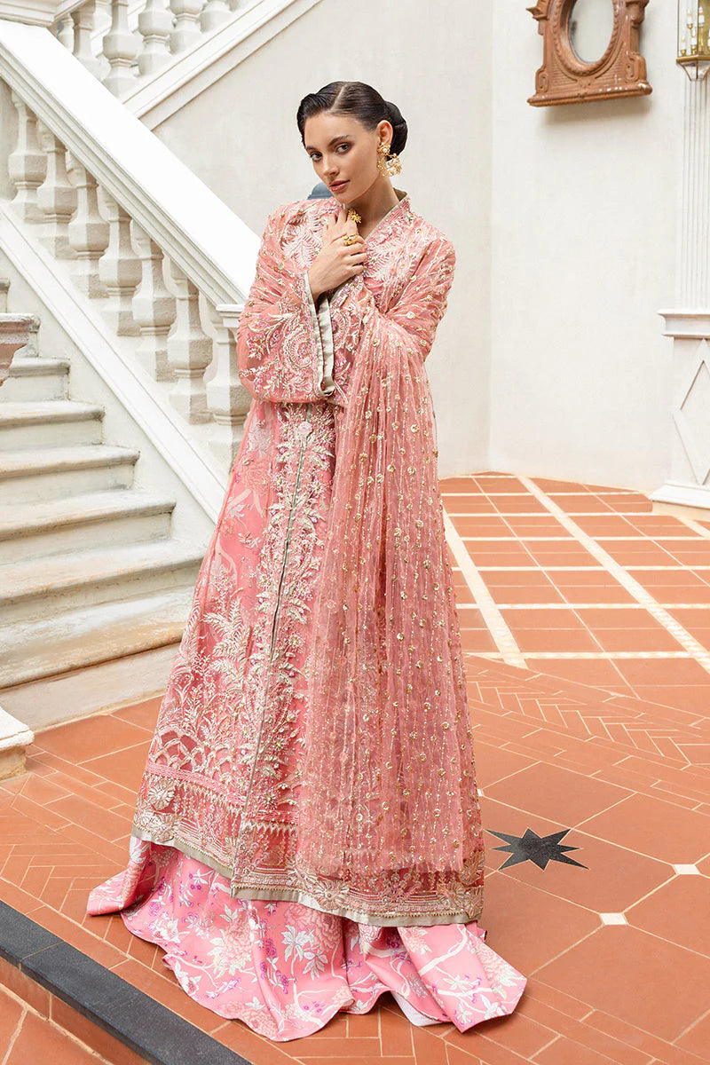 Model wearing peach embroidered dress from Mushq Wings of Desire, Pakistani luxury pret, shop authentic Pakistani clothes online in UK
