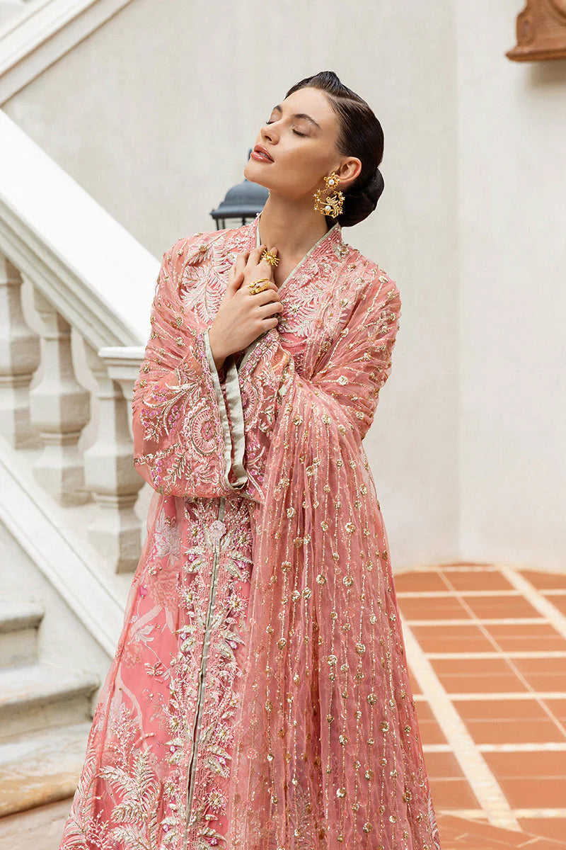 Model wearing peach embroidered dress from Mushq Wings of Desire, Pakistani luxury pret, shop authentic Pakistani clothes online in UK
