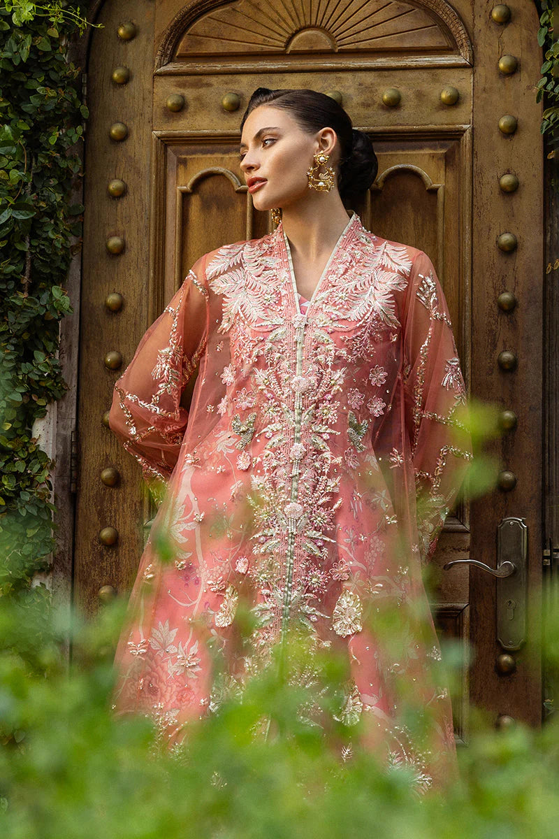 Model wearing peach embroidered dress from Mushq Wings of Desire, Pakistani luxury pret, shop authentic Pakistani clothes online in UK
