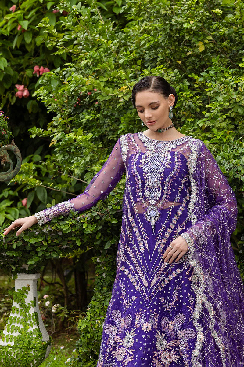 Model wearing deep purple embroidered dress from Mushq Untamed Heart, Pakistani luxury pret for weddings, shop Pakistani clothes online in UK
