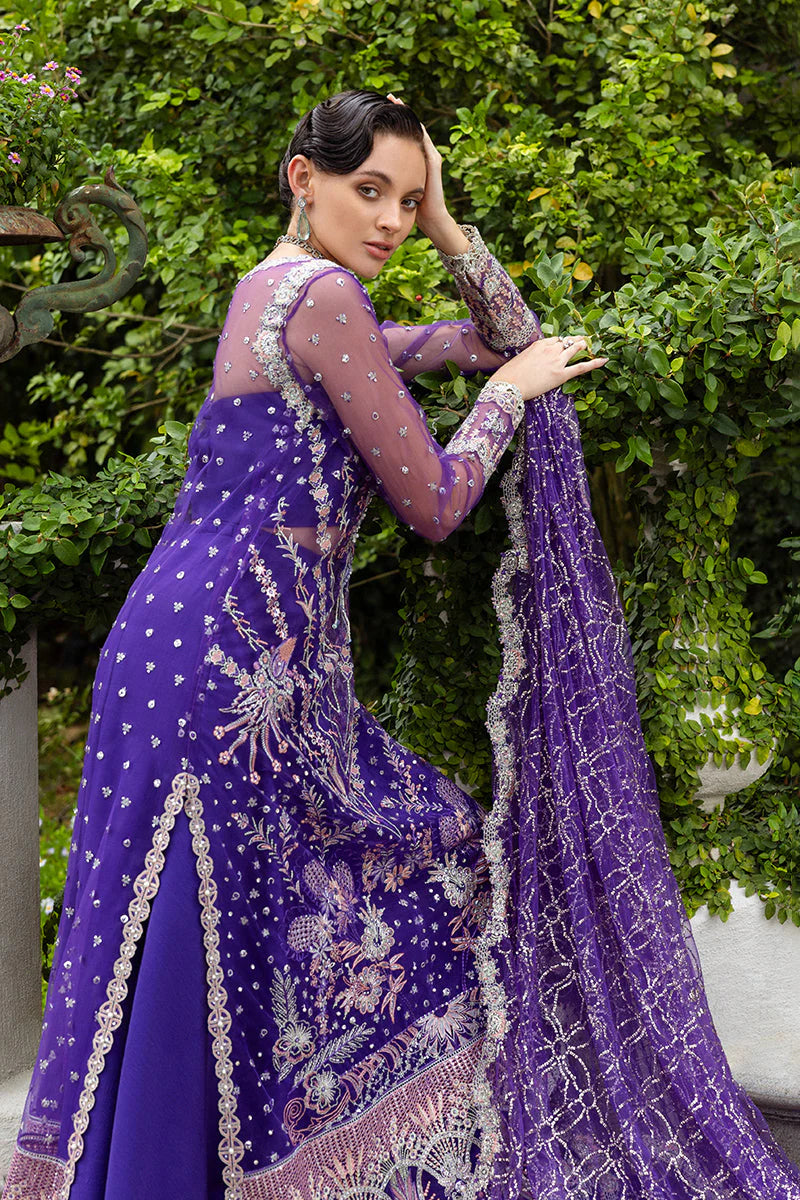 Model wearing deep purple embroidered dress from Mushq Untamed Heart, Pakistani luxury pret for weddings, shop Pakistani clothes online in UK
