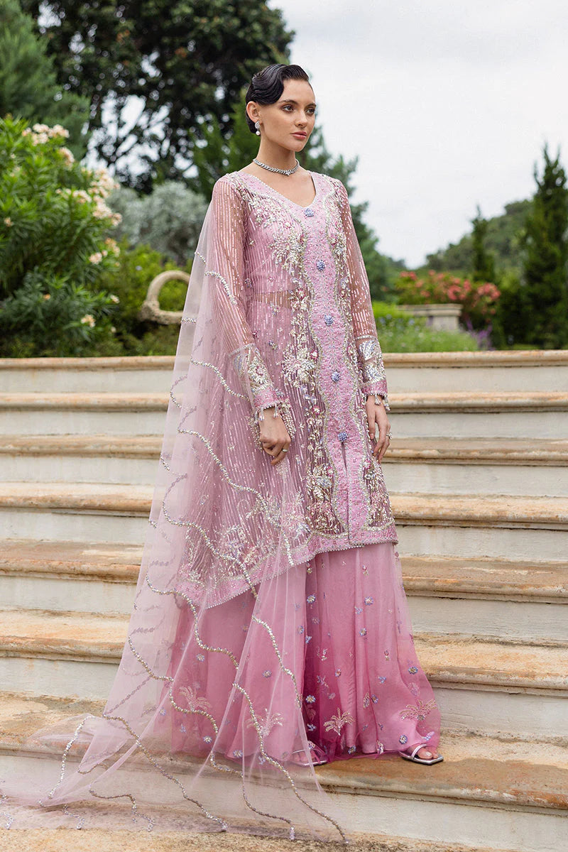 Model wearing pastel pink embellished dress from Mushq Pretty in Pink, Pakistani luxury pret ideal for weddings, shop online in UK
