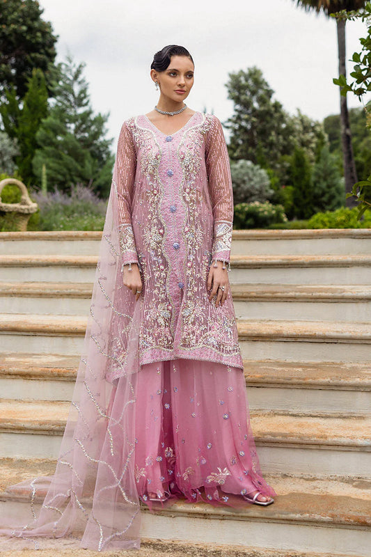 Model wearing pastel pink embellished dress from Mushq Pretty in Pink, Pakistani luxury pret ideal for weddings, shop online in UK
