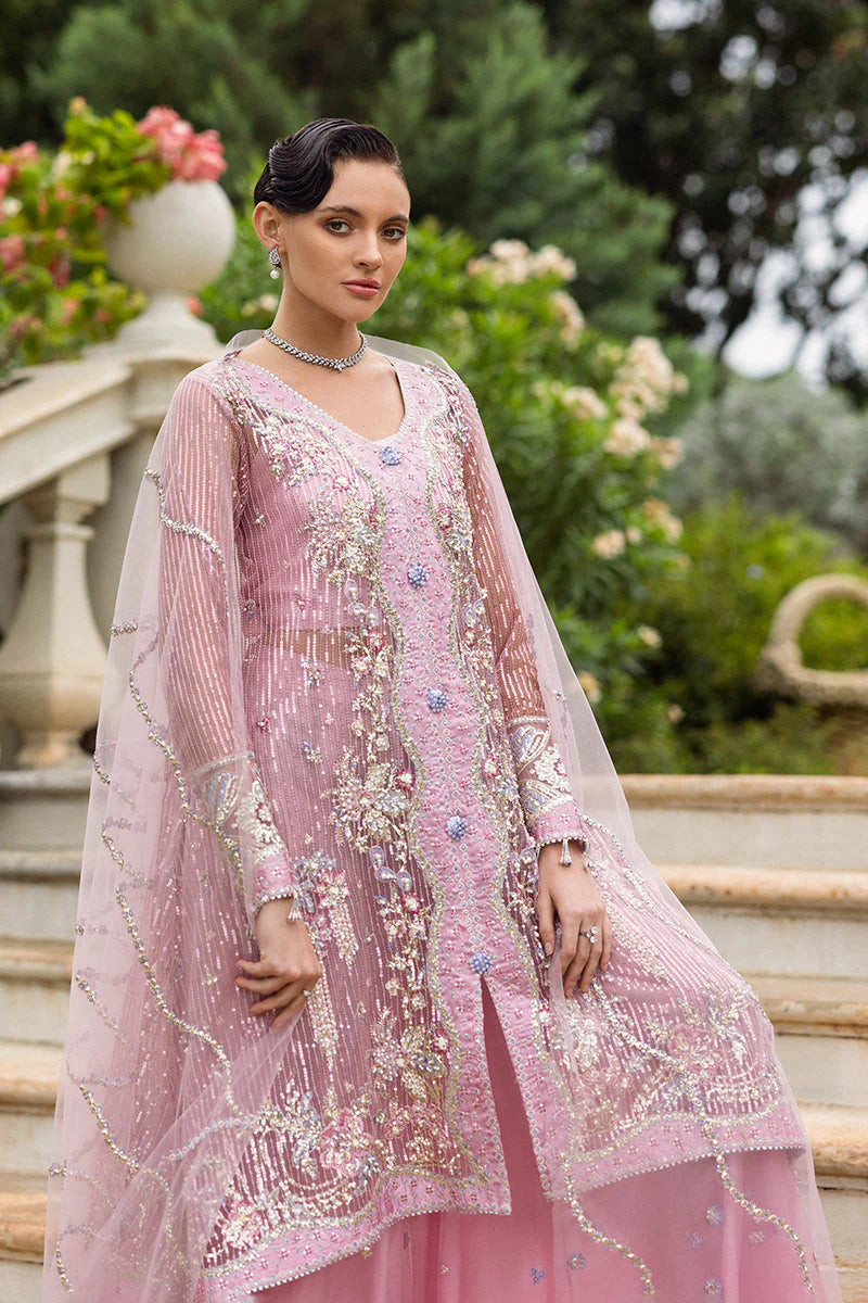 Model wearing pastel pink embellished dress from Mushq Pretty in Pink, Pakistani luxury pret ideal for weddings, shop online in UK
