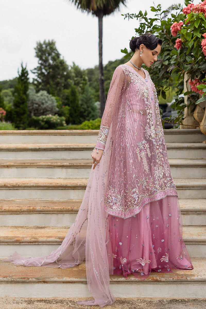 Model wearing pastel pink embellished dress from Mushq Pretty in Pink, Pakistani luxury pret ideal for weddings, shop online in UK
