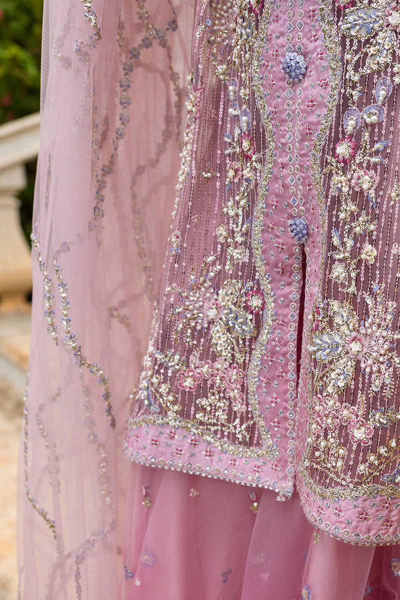 Model wearing pastel pink embellished dress from Mushq Pretty in Pink, Pakistani luxury pret ideal for weddings, shop online in UK
