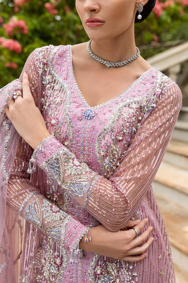 Model wearing pastel pink embellished dress from Mushq Pretty in Pink, Pakistani luxury pret ideal for weddings, shop online in UK
