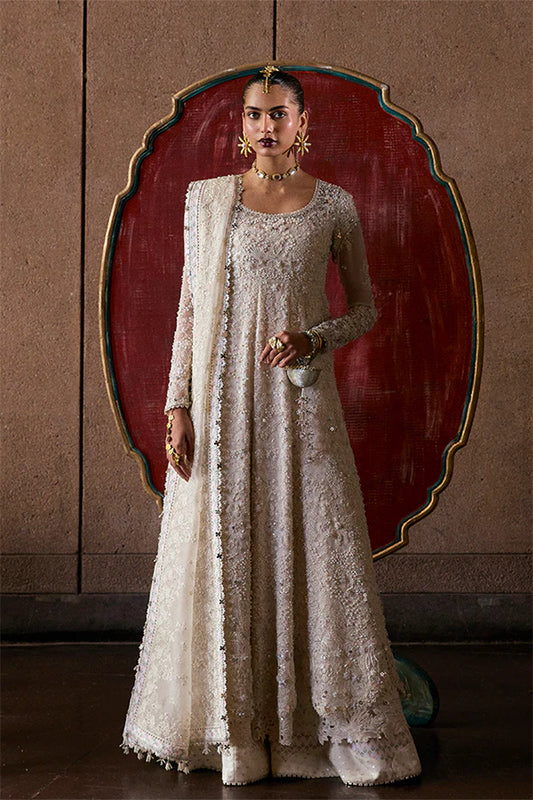 Model wearing ivory embellished gown from Suffuse Zahrell, Pakistani luxury pret, shop elegant Pakistani clothes online in UK
