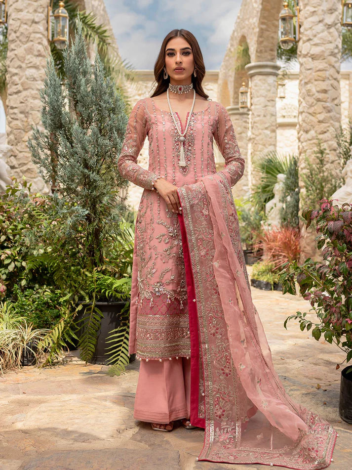 Model wearing soft pink Aethira GL-LP-V1-01 from Gulaal, featuring detailed embellishments—Pakistani luxury pret clothes online in UK.