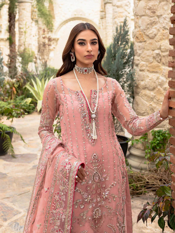 Model wearing soft pink Aethira GL-LP-V1-01 from Gulaal, featuring detailed embellishments—Pakistani luxury pret clothes online in UK.