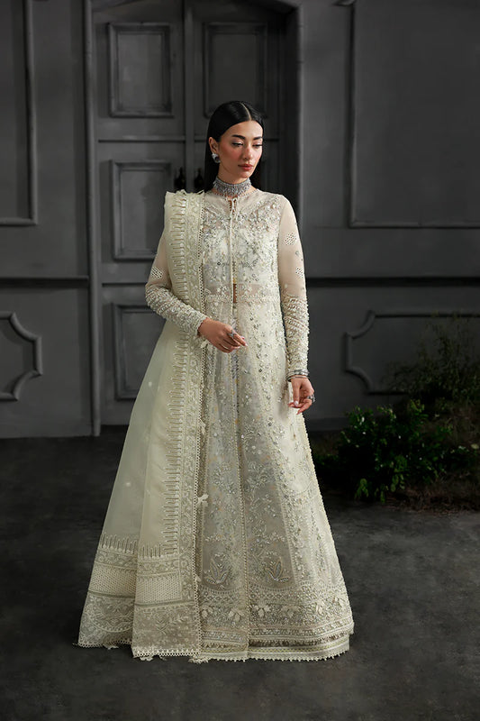Model wearing MF-06 Ivara by Qalamkar in ivory hand-embroidered dress – Pakistani luxury pret perfect for festive wear, shop online in UK.