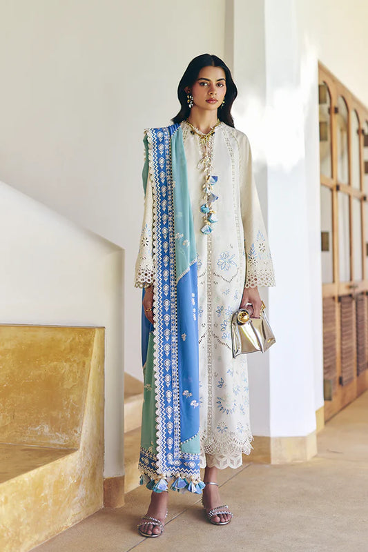 Model wearing off-white embroidered dress with blue printed dupatta from Suffuse Casual Pret 2025 Danae. Pakistani luxury pret in UK.