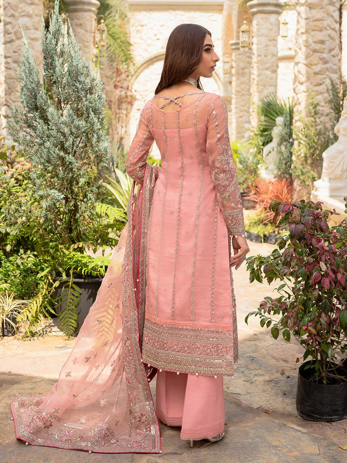 Model wearing soft pink Aethira GL-LP-V1-01 from Gulaal, featuring detailed embellishments—Pakistani luxury pret clothes online in UK.
