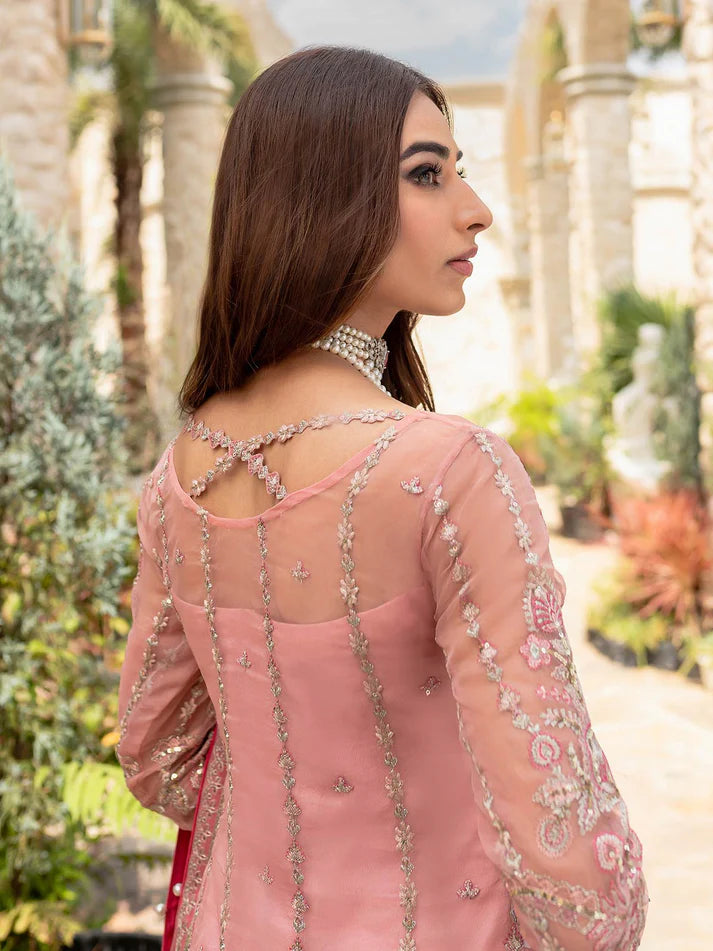 Model wearing soft pink Aethira GL-LP-V1-01 from Gulaal, featuring detailed embellishments—Pakistani luxury pret clothes online in UK.
