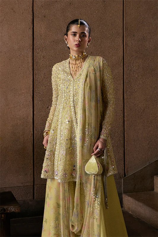 Model wearing pastel yellow embellished ensemble from Suffuse Merivah, Pakistani luxury pret, shop Pakistani clothes online in UK
