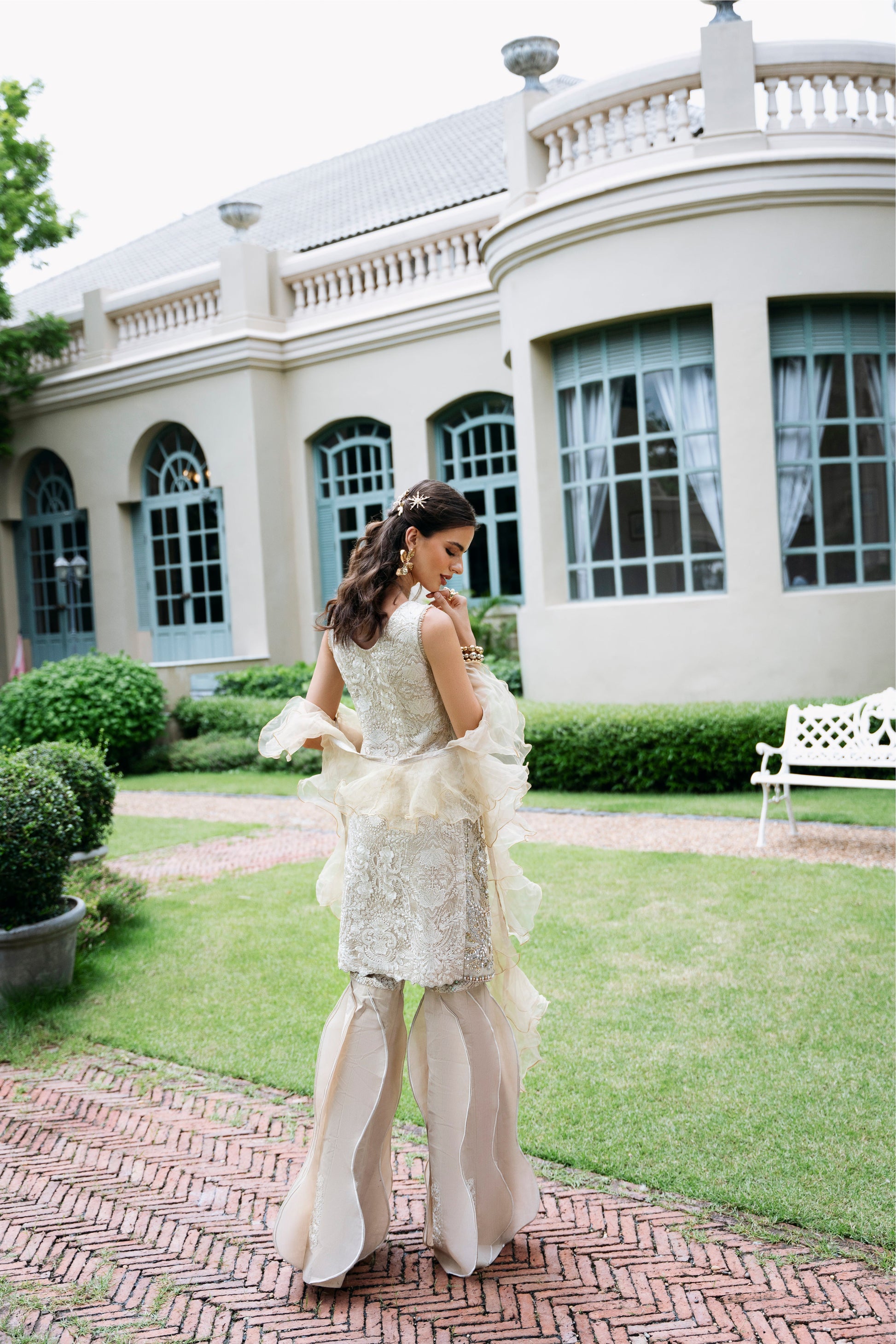 Model wearing Fifi from Mysie by Tahira, a beige embellished outfit with flared pants, perfect for Pakistani luxury pret in the UK.