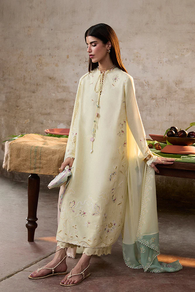 Model wearing Amaah by Suffuse in pastel yellow with delicate embroidery – elegant Pakistani luxury pret outfit in UK.