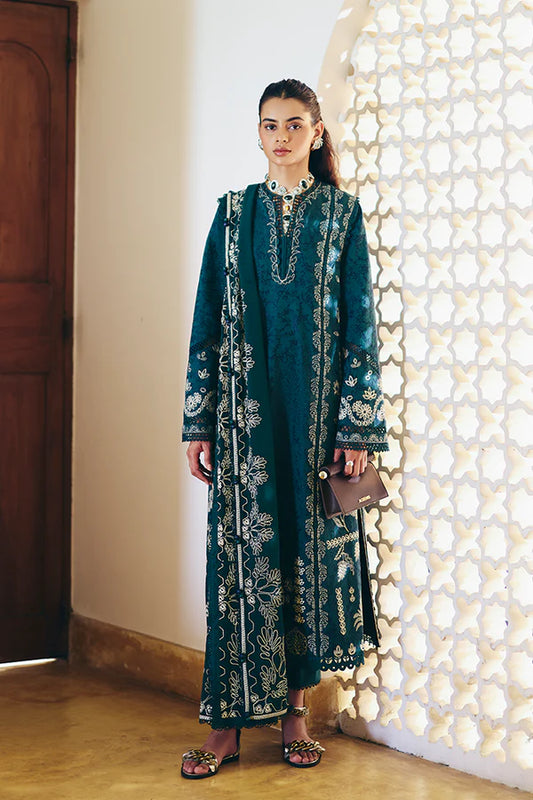 Model wearing peacock green embroidered dress from Suffuse Casual Pret 2025 Ivera. Pakistani luxury pret and Pakistani clothes online in UK.