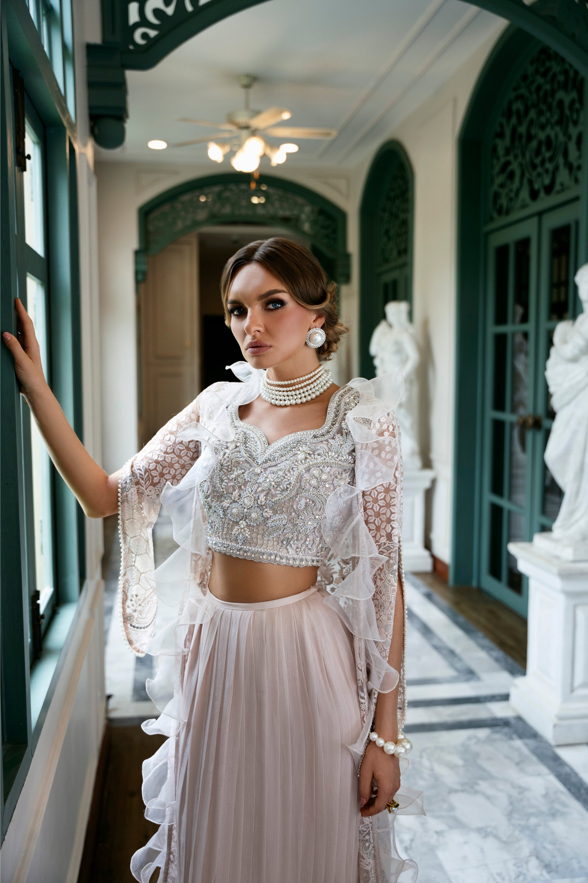 Model wearing Belisa dress from Mysie by Tahira in soft pink with intricate embellishments, perfect for Pakistani luxury pret in the UK.