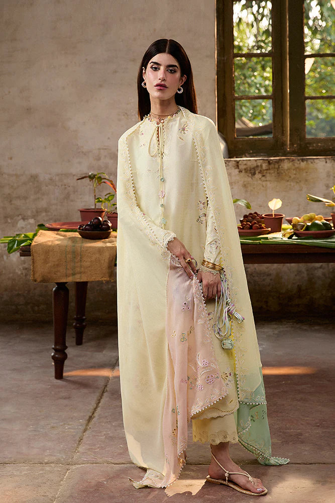 Model wearing Amaah by Suffuse in pastel yellow with delicate embroidery – elegant Pakistani luxury pret outfit in UK.