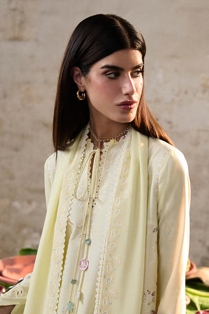 Model wearing Amaah by Suffuse in pastel yellow with delicate embroidery – elegant Pakistani luxury pret outfit in UK.