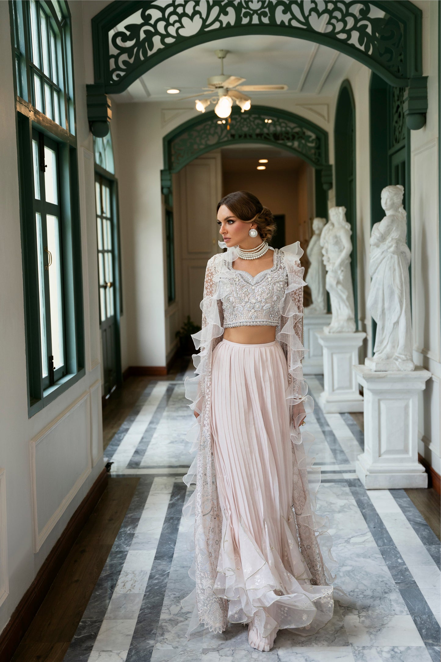 Model wearing Belisa dress from Mysie by Tahira in soft pink with intricate embellishments, perfect for Pakistani luxury pret in the UK.
