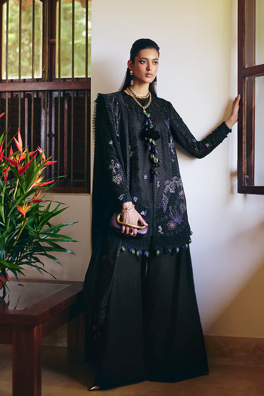 Model wearing black embroidered dress from Suffuse Casual Pret 2025 Leyla. Pakistani luxury pret and Pakistani clothes online in UK.