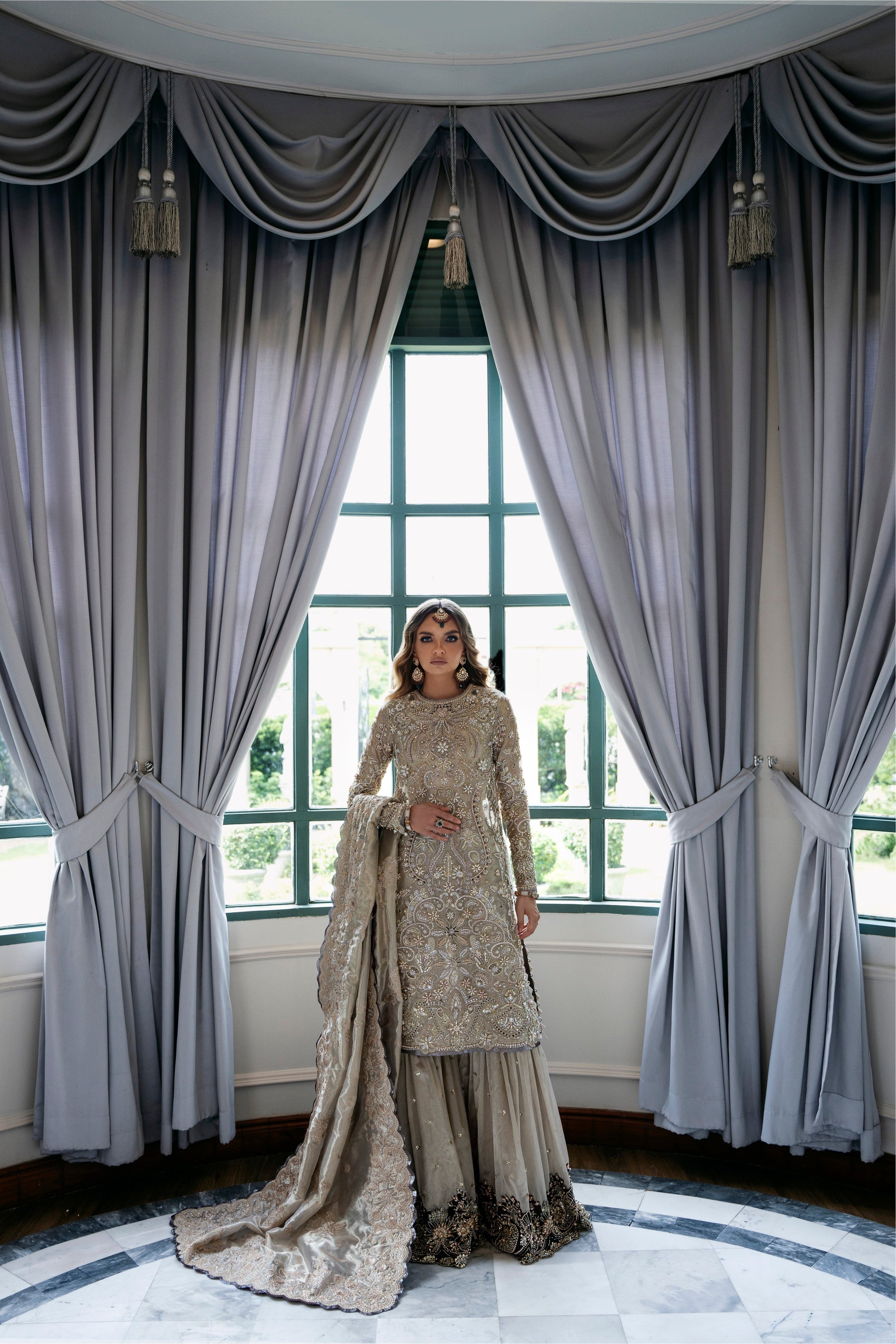 Model wearing Arya from Mysie by Tahira in beige with intricate embellishments, perfect for Pakistani luxury pret in the UK.