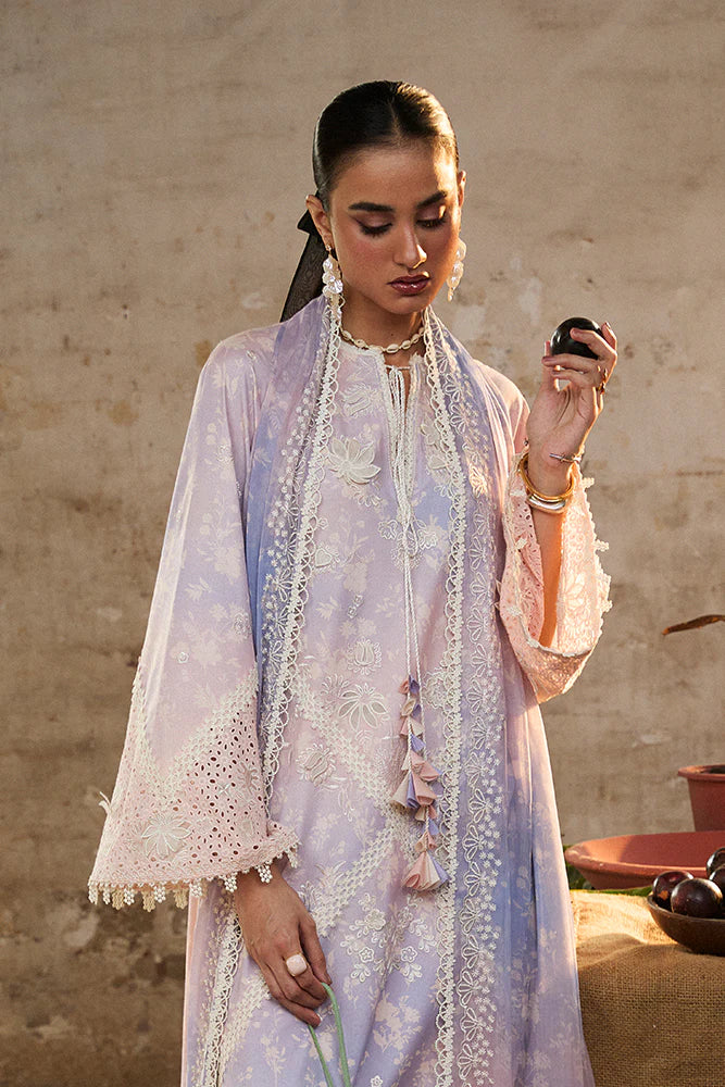 Model wearing Eeshar by Suffuse in pastel lilac and blue with delicate embroidery – elegant Pakistani luxury pret outfit in UK.