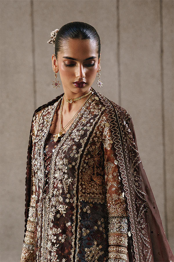 Model wearing dark brown embellished ensemble from Suffuse Vionna, Pakistani luxury pret, shop Pakistani clothes online in UK