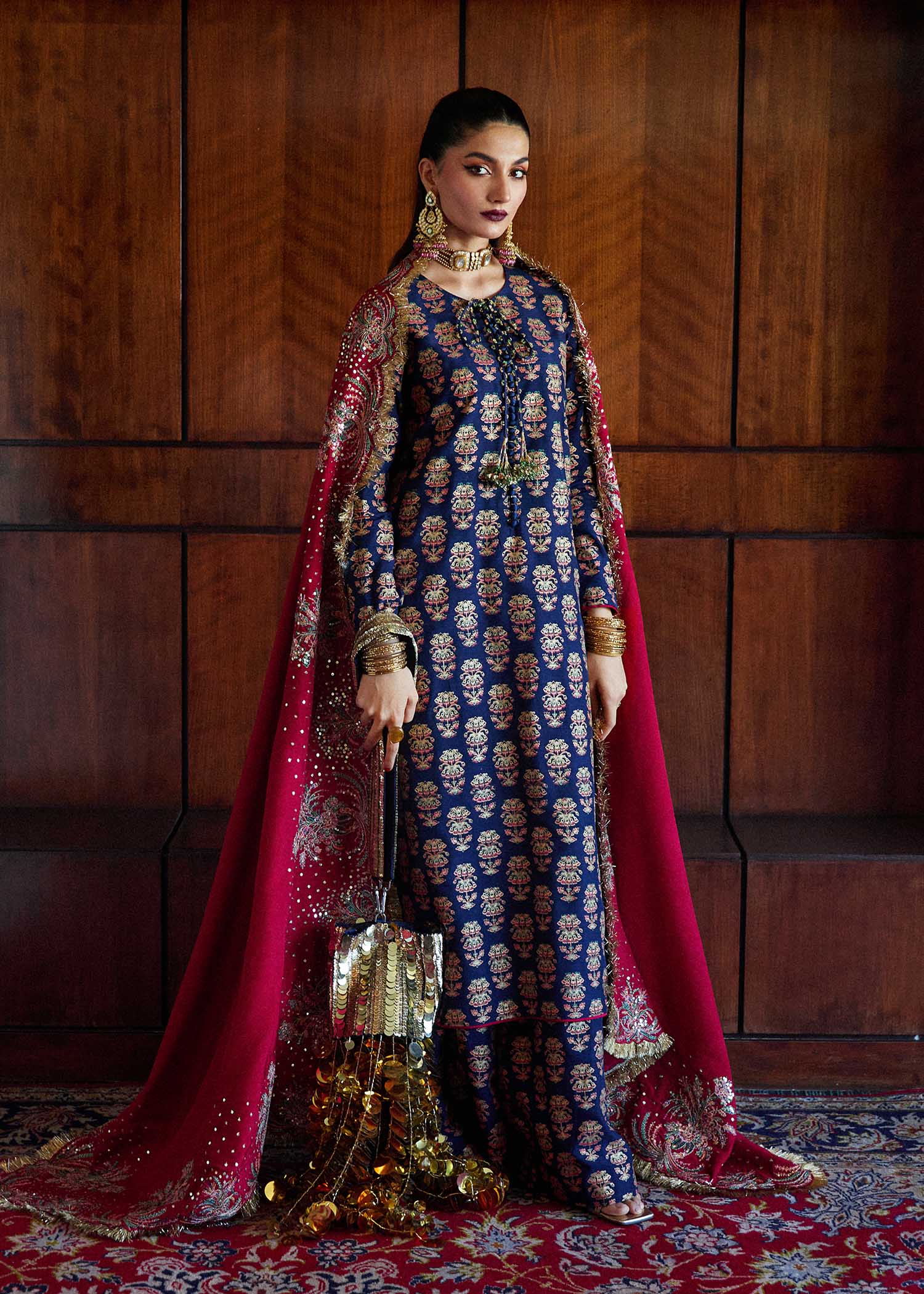 Model wearing a navy blue Pur dress from Hussain Rehar's Luxury Pret SS/24 collection. Pakistani clothes online in UK.