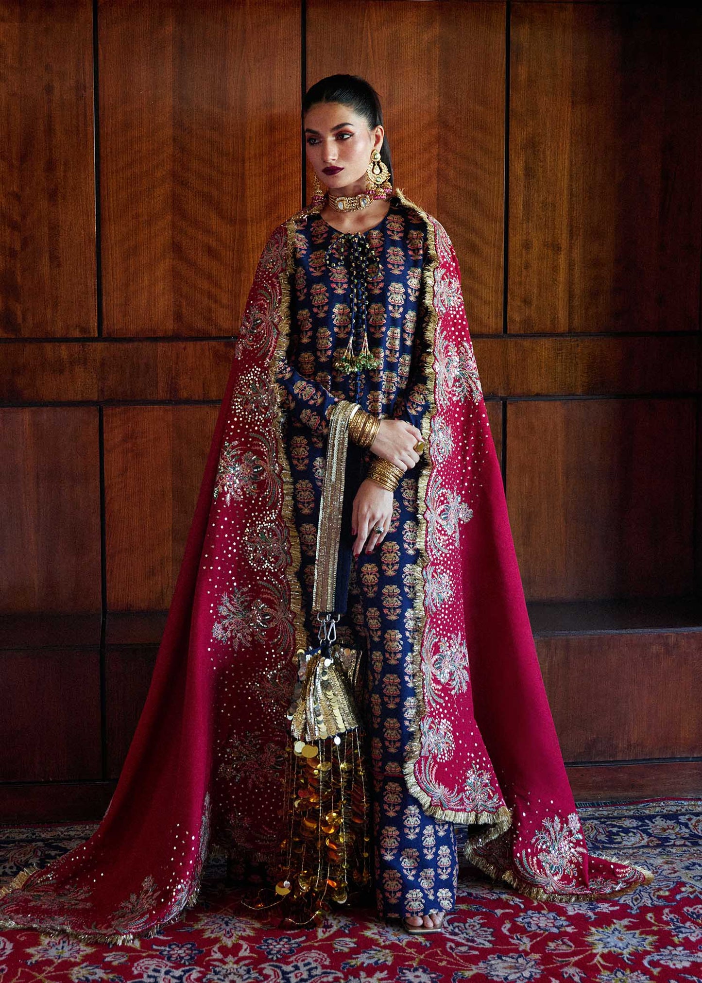 Model wearing a navy blue Pur dress from Hussain Rehar's Luxury Pret SS/24 collection. Pakistani clothes online in UK.