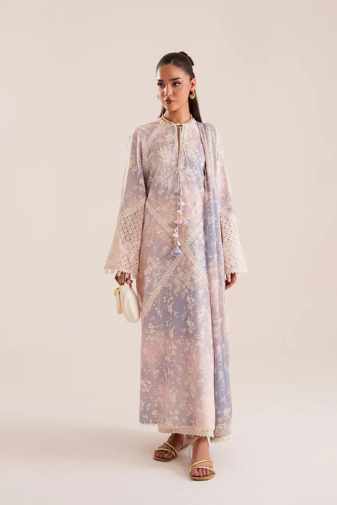 Model wearing Eeshar by Suffuse in pastel lilac and blue with delicate embroidery – elegant Pakistani luxury pret outfit in UK.