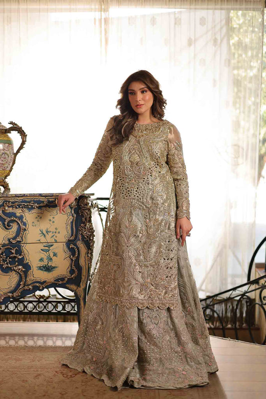 Model wearing soft beige embellished formal dress from Mysie By Tahira's Saffron, Pakistani Luxury pret available online in UK.
