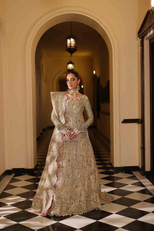 Model wearing champagne gold dress LILA from Mysie by Tahira, intricately embellished Pakistani luxury pret available online in UK.