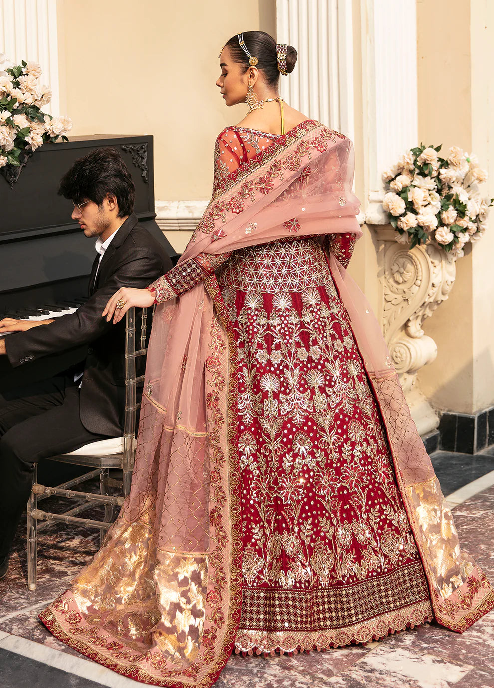 Model wearing Gulaal Unstitched Wedding Collection ZIVA GL-WU-23V1-02 lehnga choli in red hues, showcasing Pakistani clothes online in UK.