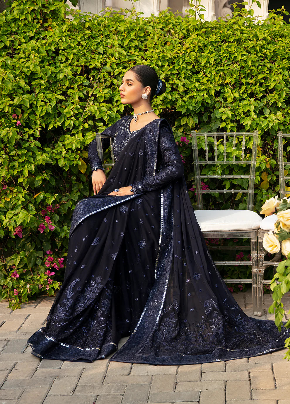 Model dons LEENA Gulaal UK dress, '23 Unstitched Pakistani wedding attire, intricate design.