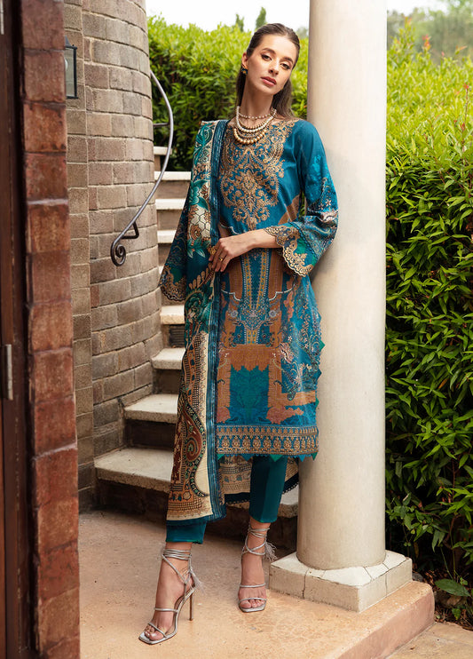 Model in Gulaal ESILA dress, teal with gold embroidery.