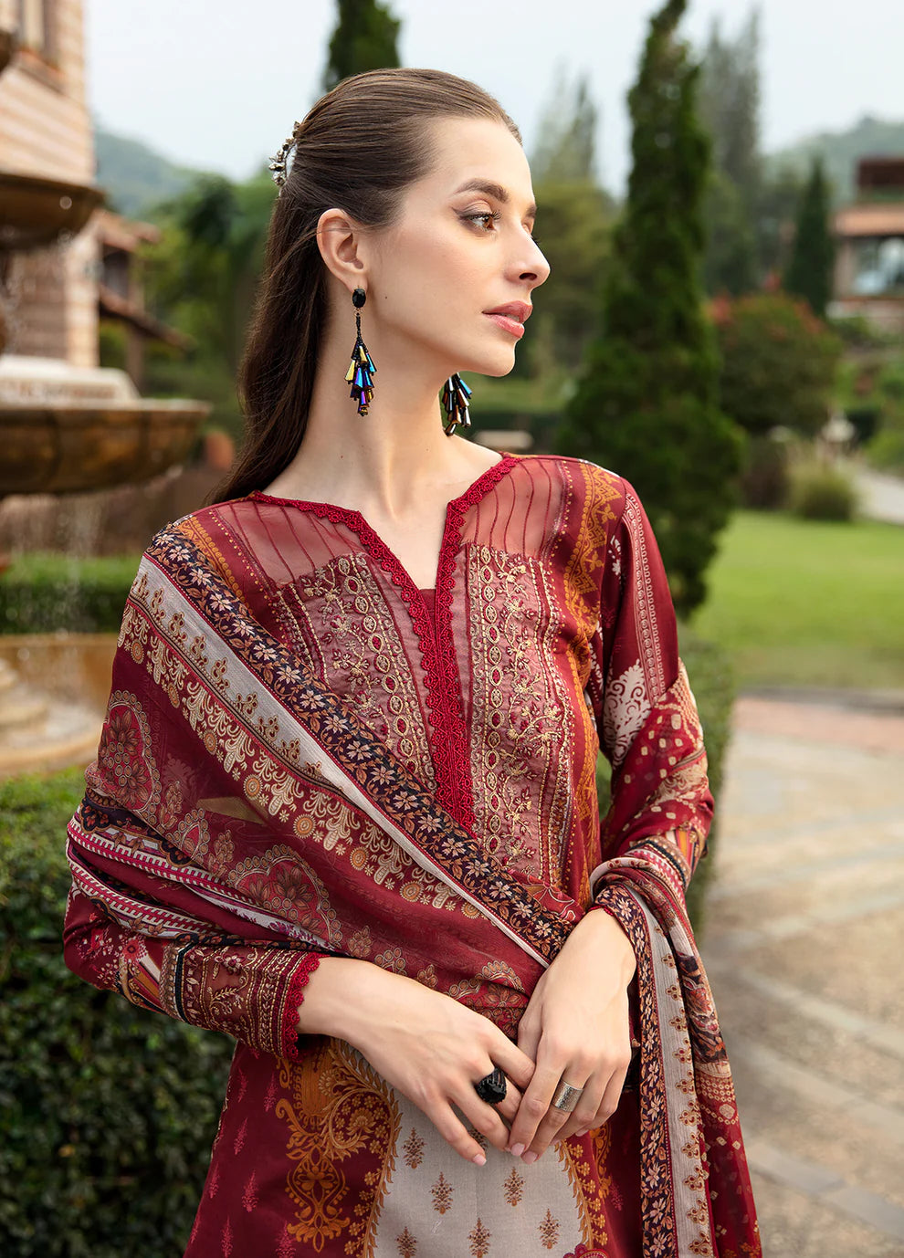 Elegant model in Gulaal's AMARYLLIS attire, rich maroon with gold print