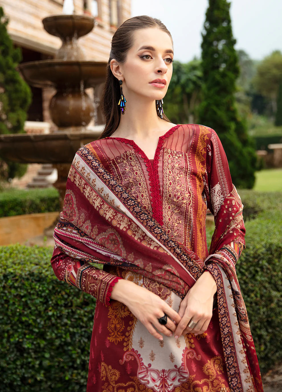 Elegant model in Gulaal's AMARYLLIS attire, rich maroon with gold print