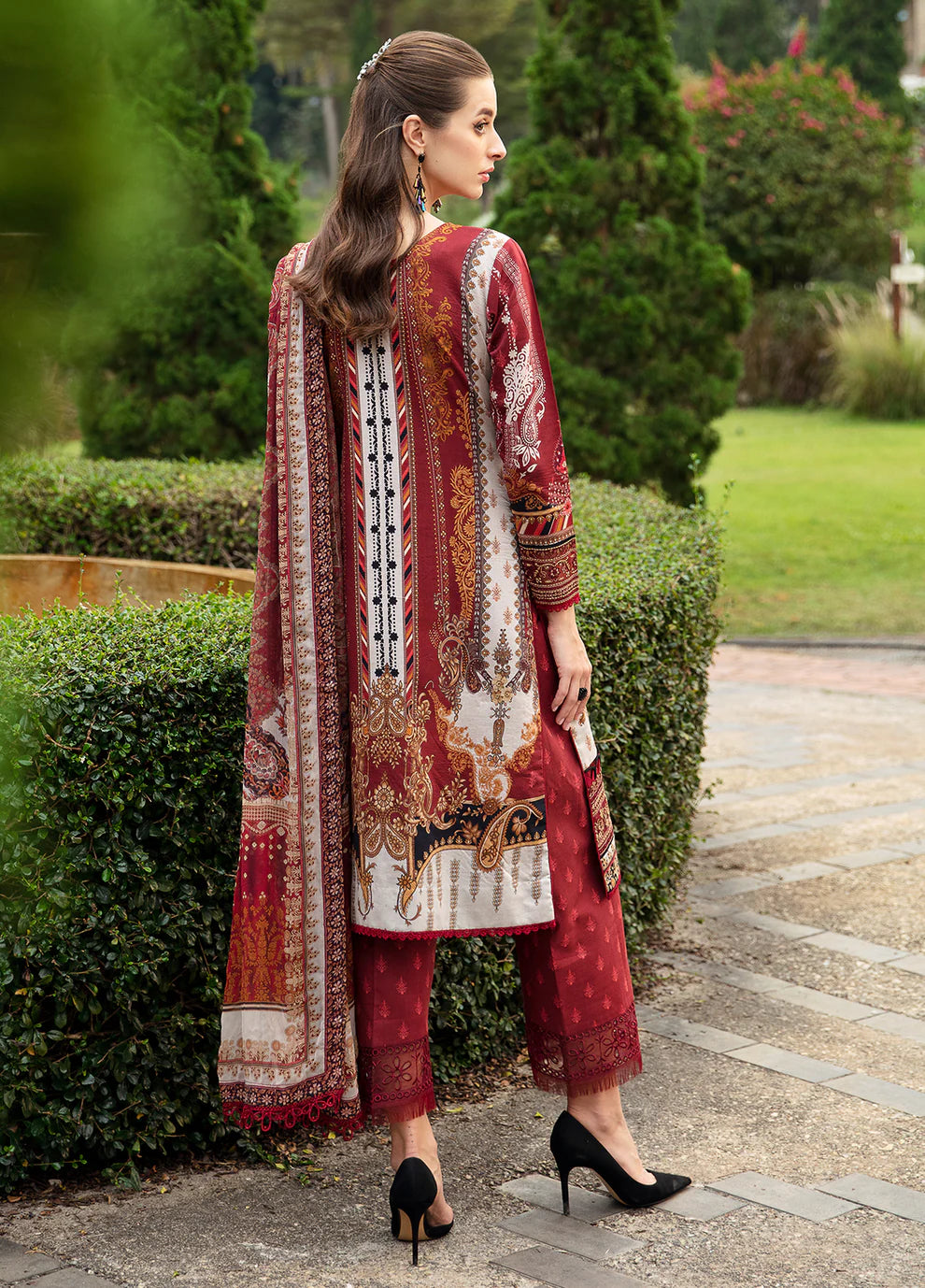 Elegant model in Gulaal's AMARYLLIS attire, rich maroon with gold print