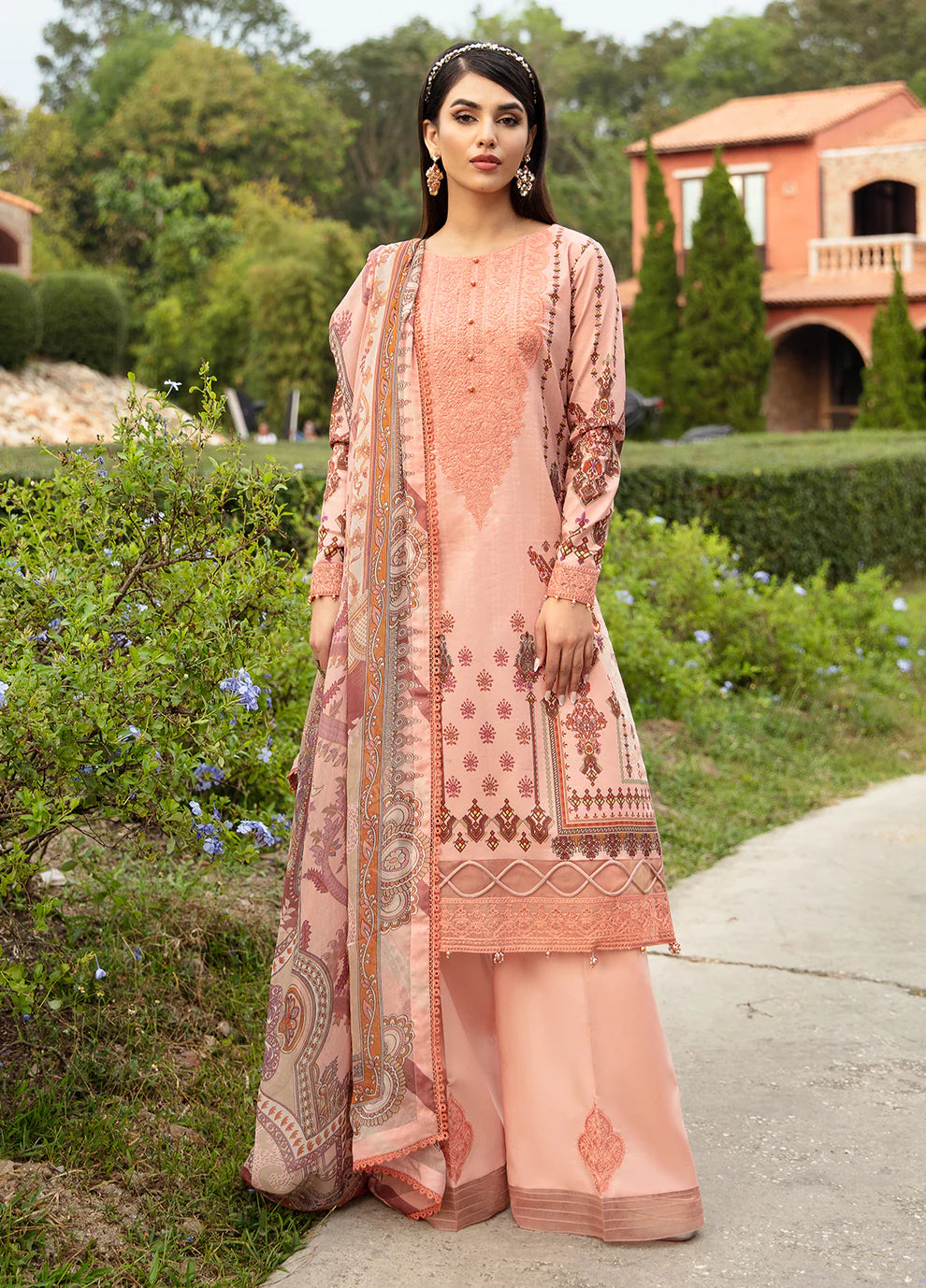 Model in Gulaal's HESTIA peach outfit, elegant embroidery