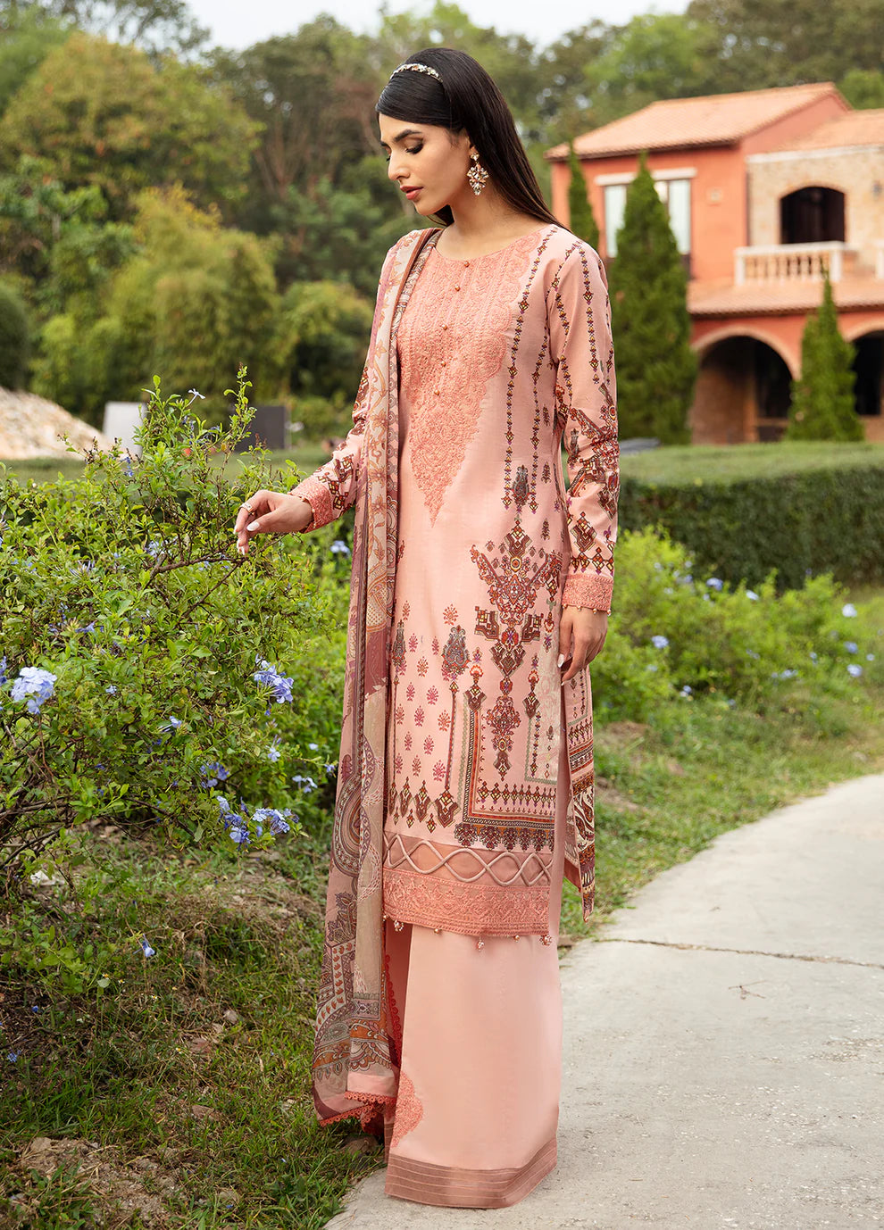 Model in Gulaal's HESTIA peach outfit, elegant embroidery