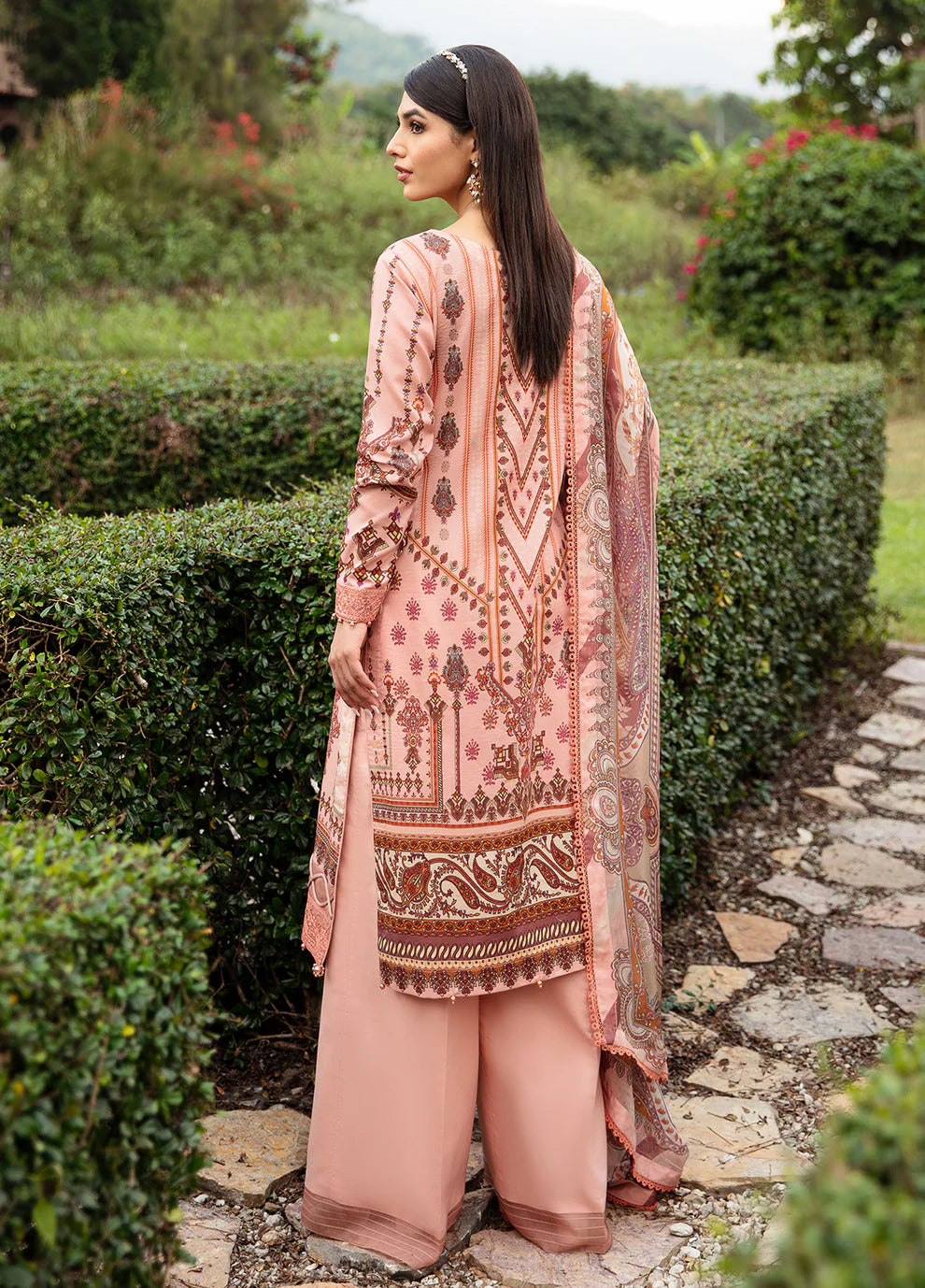 Model wearing elegant peach HESTIA GL-L-24V1-12 dress from Gulaal's Spring Ballet 2024 collection, showcasing Pakistani clothes online in the UK.